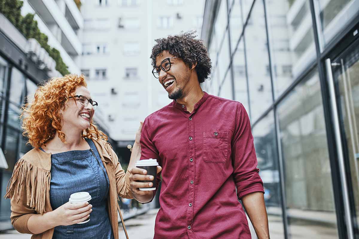 people walks with coffee cups